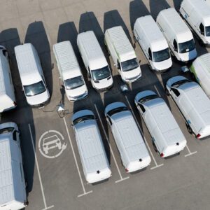 White vans parked in a lot