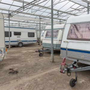 Covered area with parked caravans.