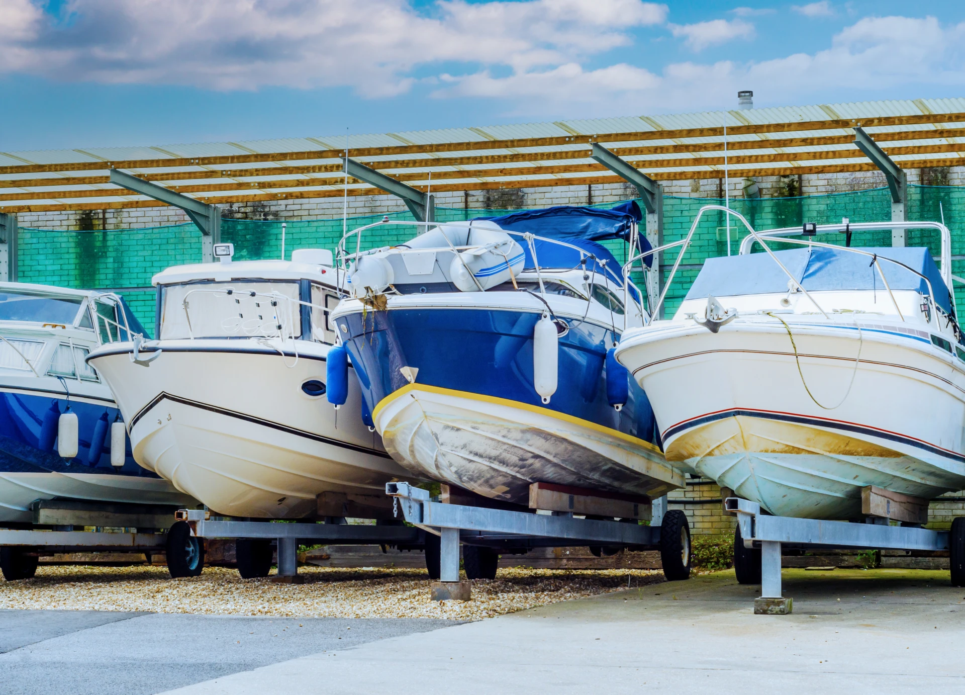 Docked boats lined up on land.