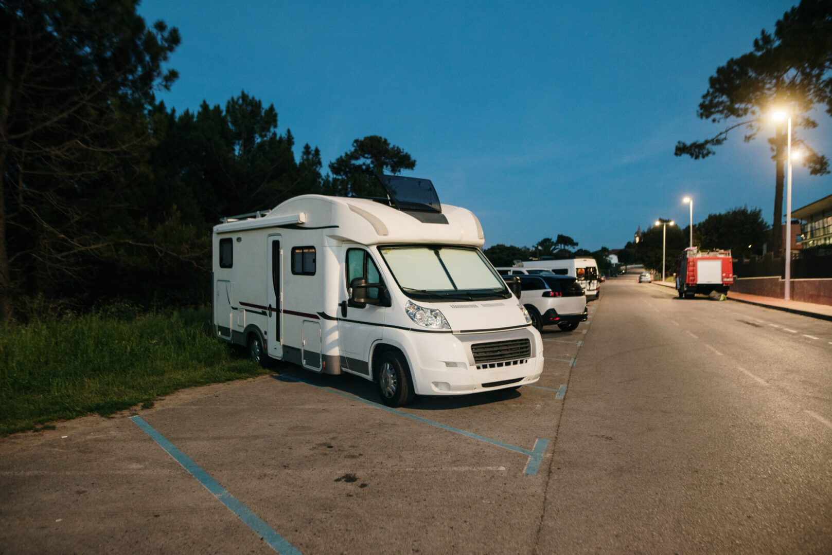 Motor home in a parking lot at night